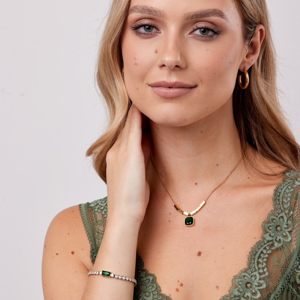 "18k gold plated , emerald glow, eternal elegance."

Hypoallergenic and Super Skin Friendly.

