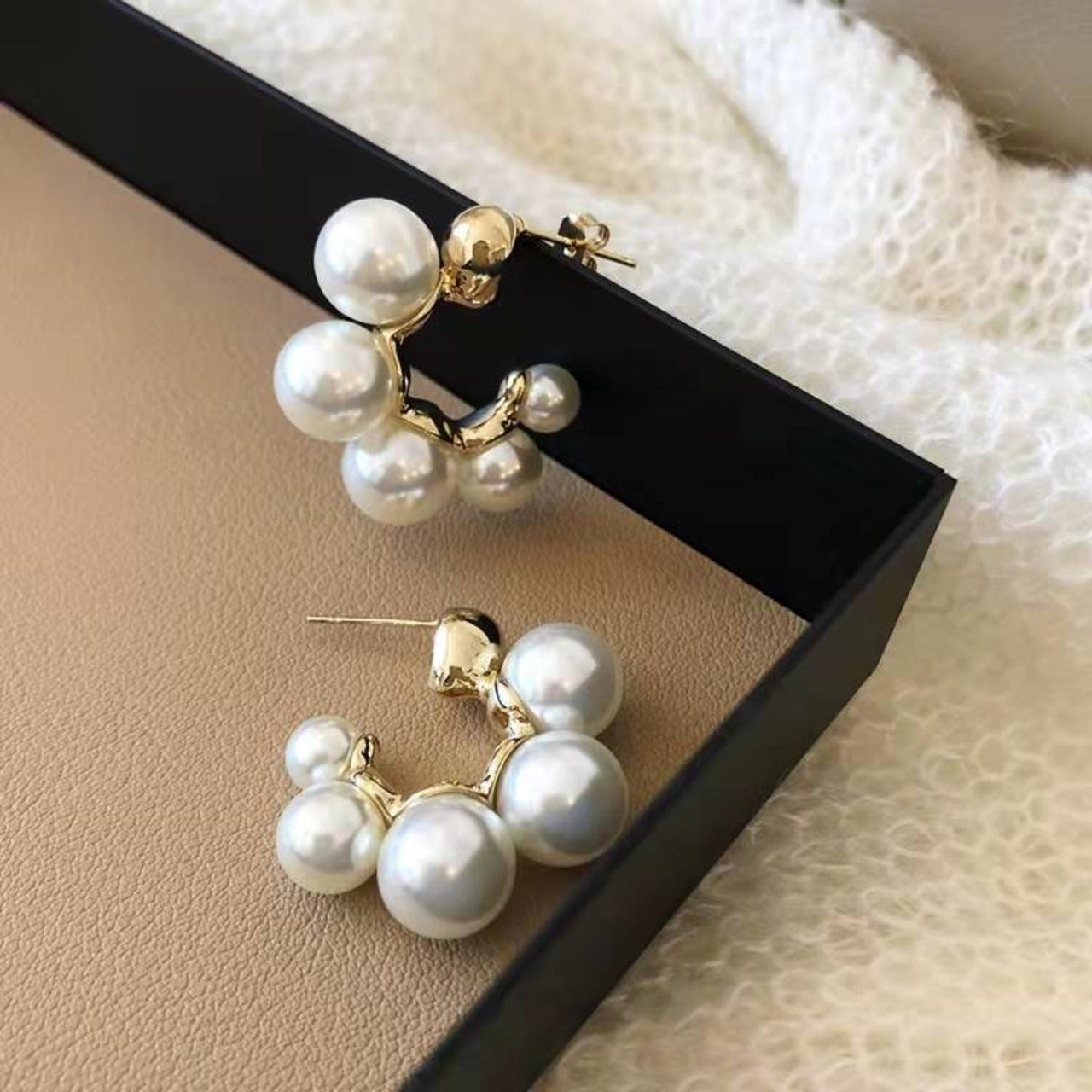 "Glamorous pearl earrings, an ideal gift for women."
