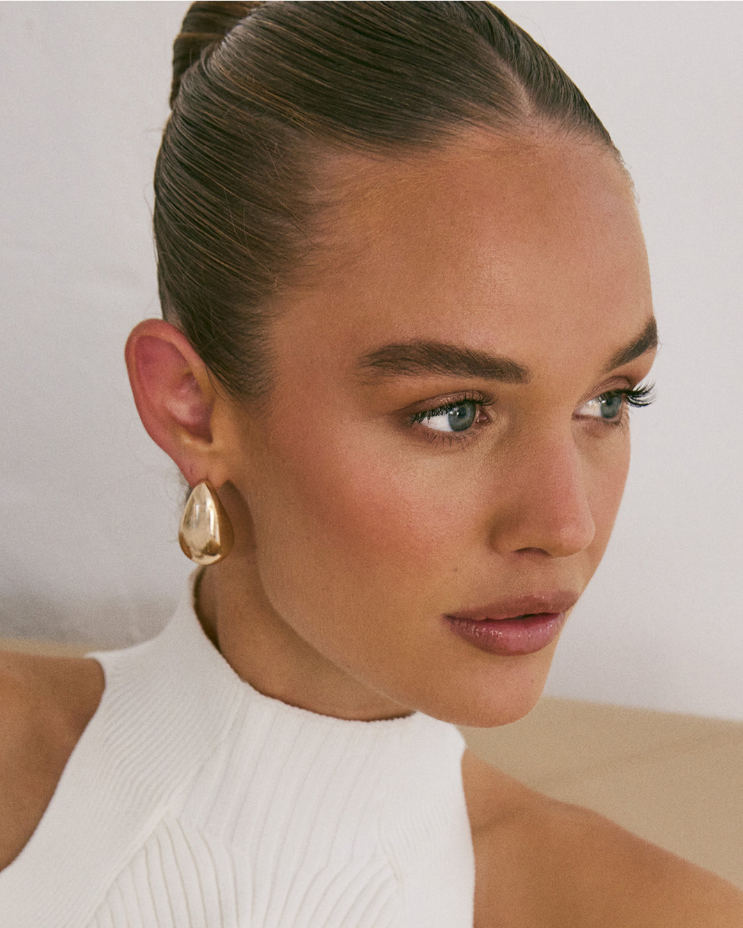 "Elegant gold earrings for women’s daily wear, offering classic charm."