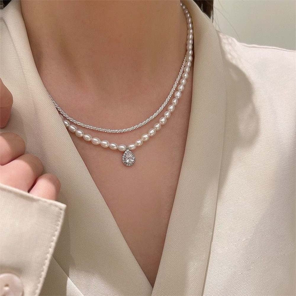 "Elegance redefined with pearls and a silver touch."

"Timeless pearls, beautifully paired with a silver chain."