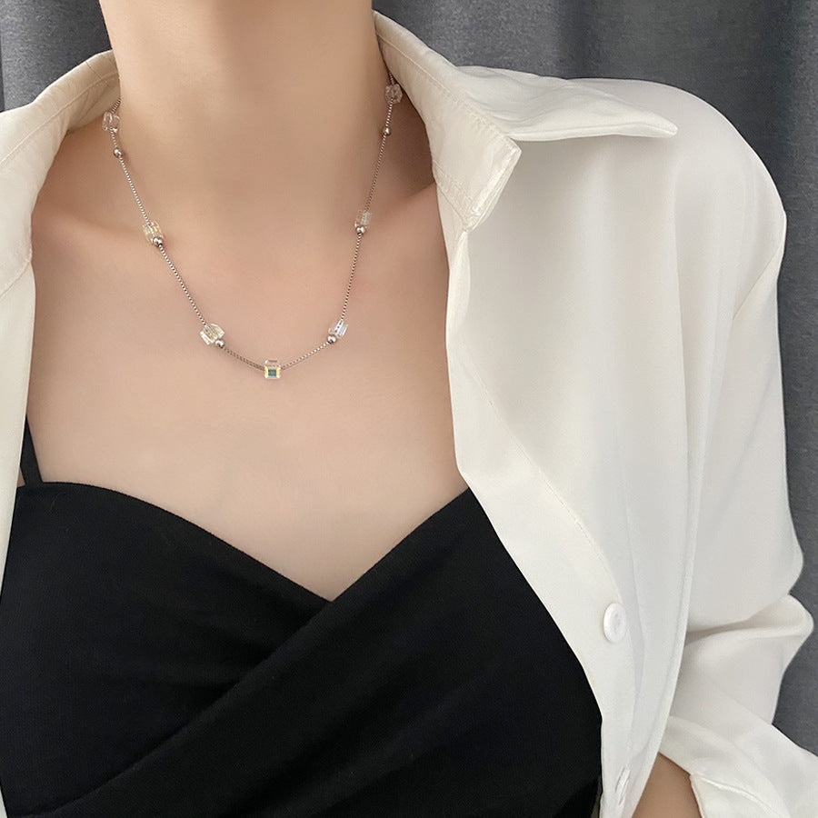 The Shifting Stone Necklace features a captivating pendant with a unique, dynamic stone that changes hues with the light. 