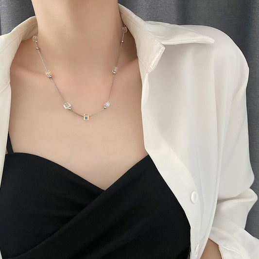 The Shifting Stone Necklace features a captivating pendant with a unique, dynamic stone that changes hues with the light. 