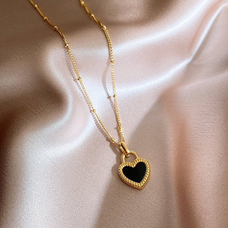"Wear love both ways with the Reversible Shell Heart Necklace."