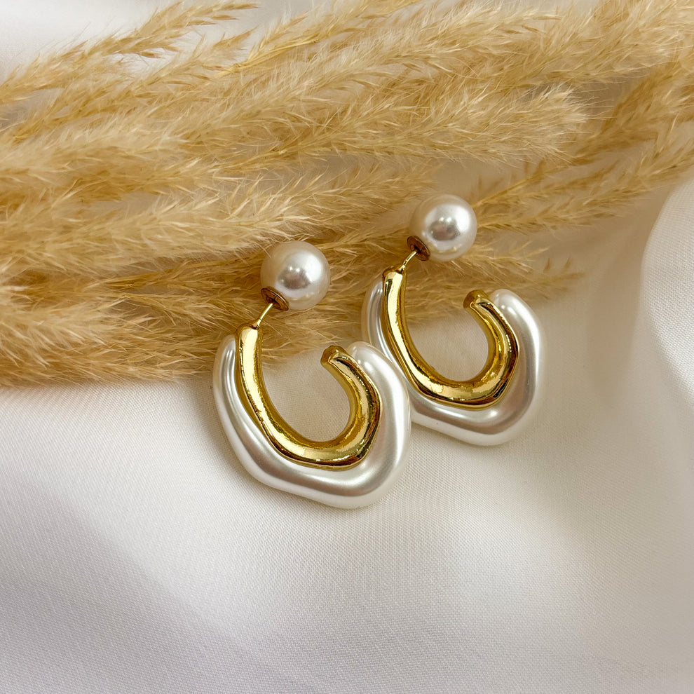 "These earrings are the perfect balance of timeless beauty and modern style, perfect for adding a refined touch to any look."