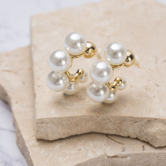 "Timeless Pearl Hoops Earrings featuring lustrous pearls on sleek hoops,

 perfect gift for any occasion with their elegant and versatile design."