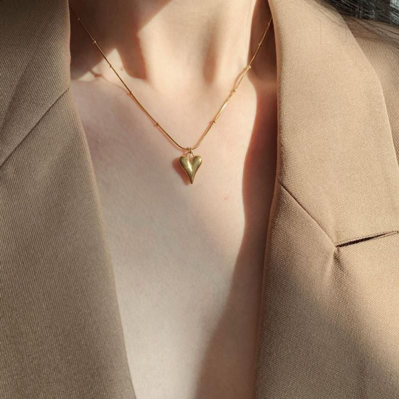 "Cosmic energy, captured in a heart of 18K gold."