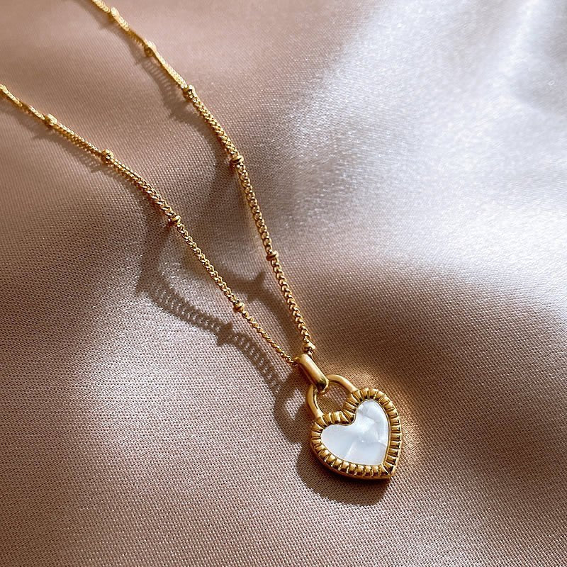 "Two looks, one necklace – a heart that shines both ways."