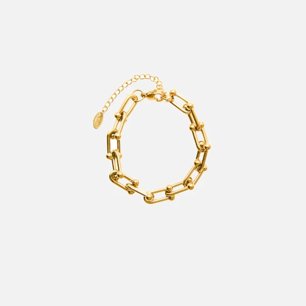 18k gold plated over stainless steel Water/Tarnish Resistant
