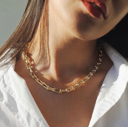 18k gold plated over stainless steel Water/Tarnish Resistant
