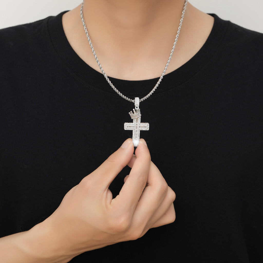 A regal crown rests atop the cross, representing royalty and honor.