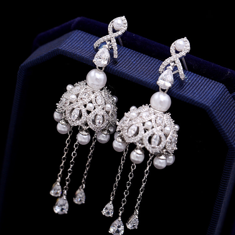 Bohemian Tassel Bells Earrings featuring vibrant tassels and delicate bells, designed with an anti-tarnish finish for lasting shine and durability.