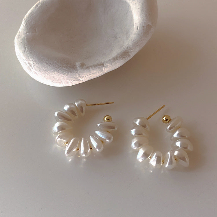 offering a modern and elegant twist on classic hoop earrings."