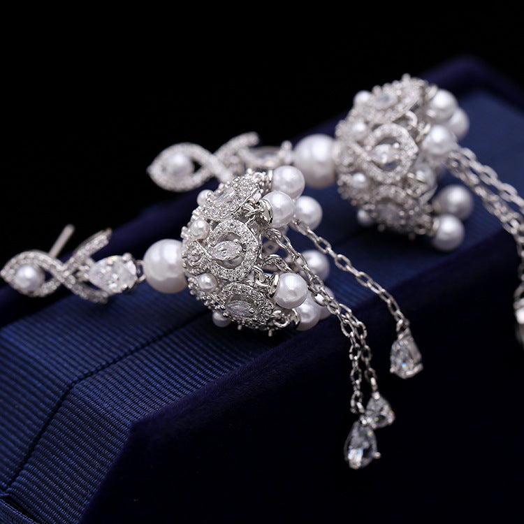 Anti-tarnish pearl Earrings with a polished finish."
