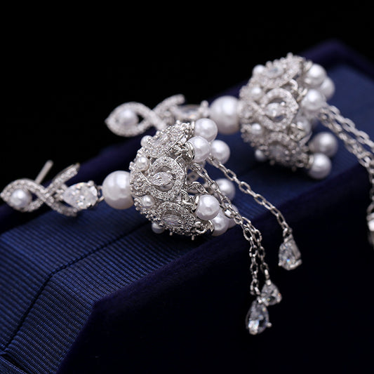 Anti-tarnish pearl Earrings with a polished finish."
