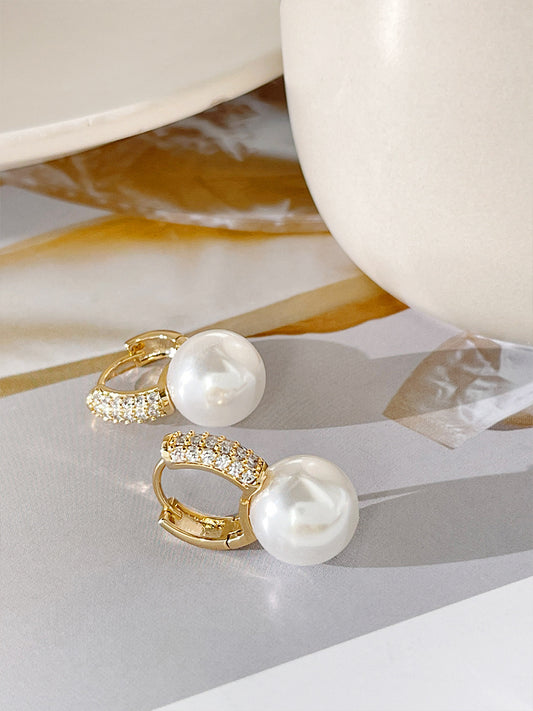 "Say goodbye to tarnish! The Faux Pearl Earrings offer a tarnish-free shine, making them a hassle-free addition to your jewelry collection."