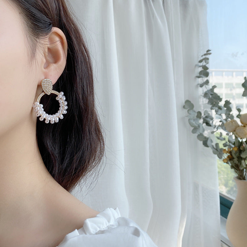 Elegant Pearl Earrings featuring a smooth 

"Anti-tarnish pearl earrings with a polished finish."

