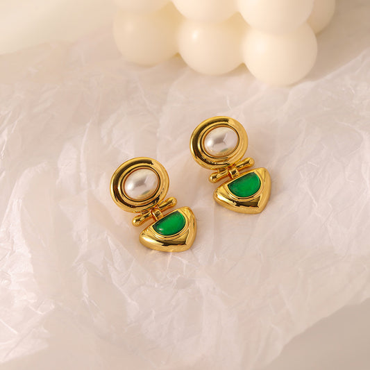"Elegant Pearl and Emerald Hooked Earrings featuring a lustrous pearl paired with a vibrant emerald gemstone"