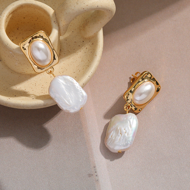 "Anti-tarnish pearl earrings with a polished finish."
