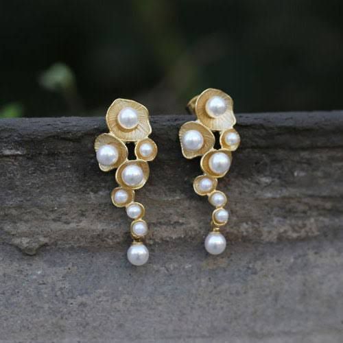 A timeless piece with an organic twist, the Nest Pearl Earrings make an elegant gift for someone who loves unique, artisanal jewelry.