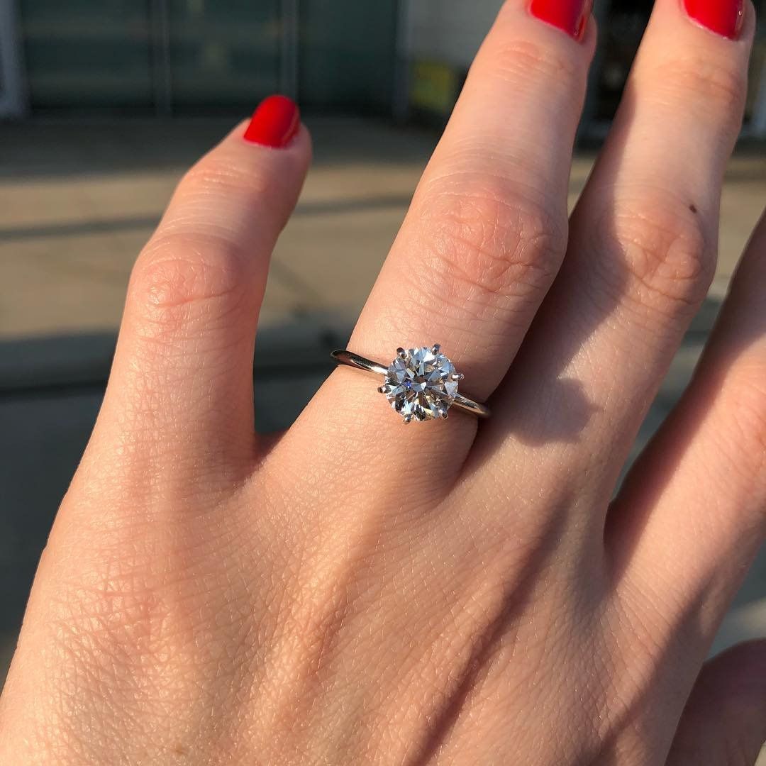 "Grace in its purest form – Classic Solitaire Ring, hallmarked to last."

