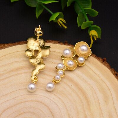 These earrings combine the timeless beauty of pearls with a modern, organic design, making them a perfect statement piece.
